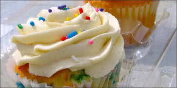 Cupcake with Vanilla Icing and Sprinkles